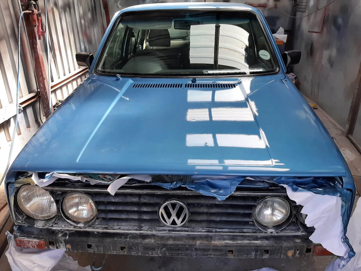 VW Golf Front-End Body Restoration — VW Golf bonnet after spray painting