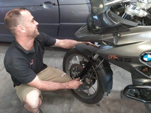 Replacing brake pads on a BMW F700 GS motorcycle - full service and new brake pads by GP Motor Works