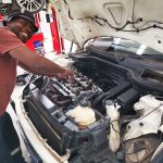 Mini Cooper technician works on engine rebuild at GP Motor Works