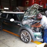 Mini Cooper S in at GP Motor Works for excessive smoking and engine noise - shows technician replacing timing chain