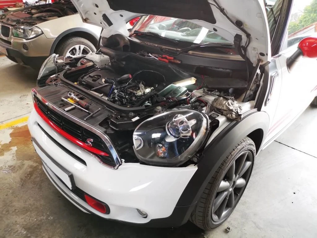 Oil and Coolant Leaks: Why Early Diagnosis Matters — Mini Cooper with water leaks