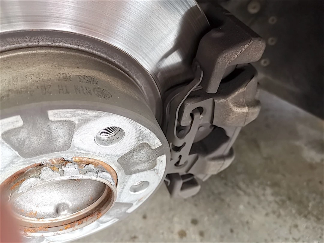 Why Do Brakes Squeak? — BMW 320i disc and caliper closeup