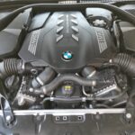 BMW M850 XDrive - engine bay view with damaged gear selector being replaced at GP Motor Works