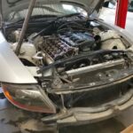 BMW Z4 engine bay with head removed in order to reset the timing and idling at GP Motor Works